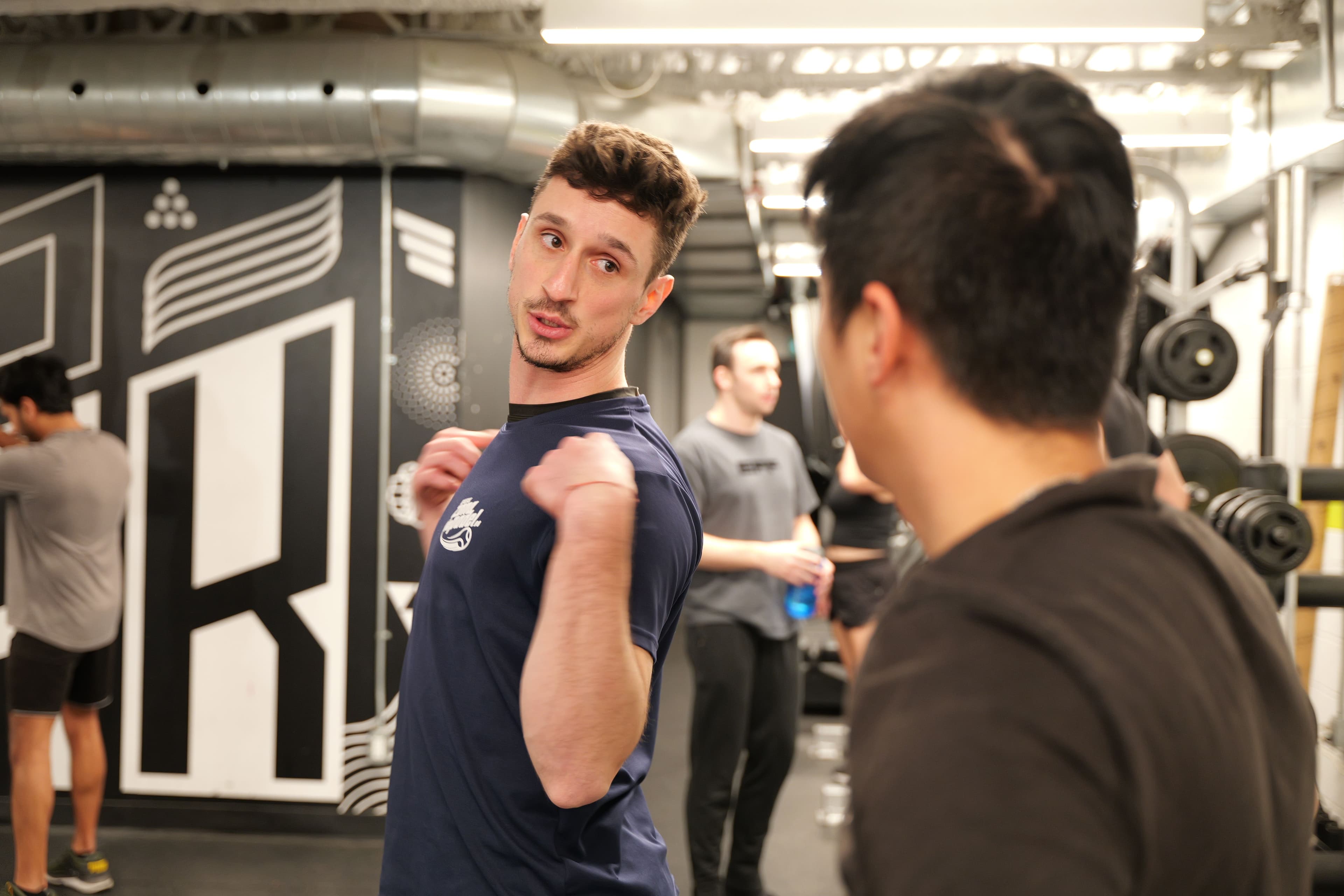 Jonny mid-explanation during coaching, eyes open and engaged